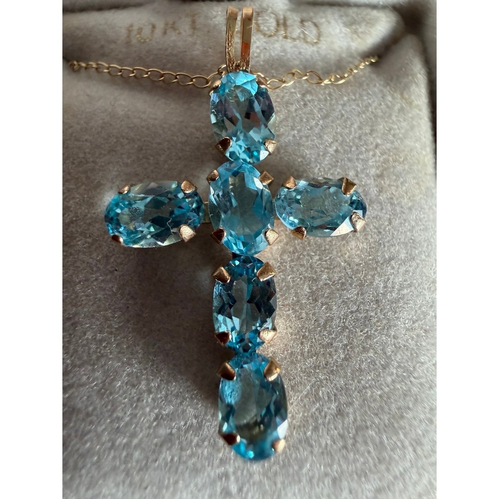 Beautiful solid 10K gold cross pendant necklace featuring genuine blue topaz gem